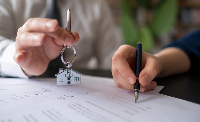Signing papers for home purchase