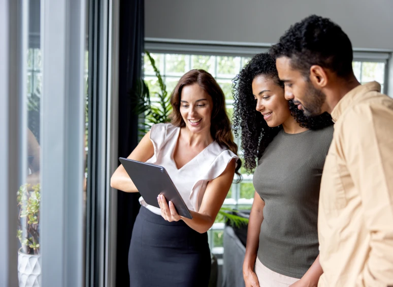 People discussing something on a digital tablet